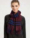 Luxurious cashmere wrap is adorned with an outstanding check design with fringe trim.Cashmere47 X 11Dry cleanImported
