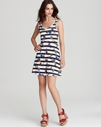 Stripes over florals are fun and flirty on this whimsical Volcom dress with a front and back scoop neckline. Optimal for your day cruising the boardwalk-wear it flip-flops or chunky wedges. Stripes over florals are fun and flirty on this whimsical Volcom dress with a front and back scoop neckline. Optimal for your day cruising the boardwalk-wear it flip-flops or chunky wedges.