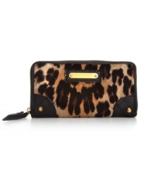 Get your glam on with this luxe leopard print wallet from Juicy Couture that speaks sass and seduction. The exterior is dressed in plush velour, soft leather trim and shiny golden hardware, while plenty of slots and compartments organize the inside. Get your glam on with this luxe leopard print wallet from Juicy Couture that speaks sass and seduction. The exterior is dressed in plush velour, soft leather trim and shiny golden hardware, while plenty of slots and compartments organize the inside.