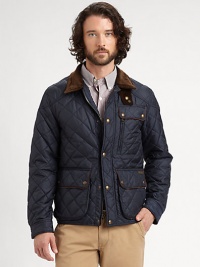 Warm quilted design with corduroy accents and leather trimmed pockets.Front zipper with snap placketCorduroy collar with neck tabSnap flap and zippered chest pocketLeather-trimmed snap-flap pocketsCorduroy-lined cuffs with snap tabsAdjustable snap tabs on the sidesBack snap vents at hemInside welt pocketNylon liningPolyester fillAbout 26 from shoulder to hemPolyesterDry cleanImported Warm quilted design with corduroy accents and leather trimmed pockets.Front zipper with snap placketCorduroy collar with neck tabSnap flap and zippered chest pocketLeather-trimmed snap-flap pocketsCorduroy-lined cuffs with snap tabsAdjustable snap tabs on the sidesBack snap vents at hemInside welt pocketNylon liningPolyester fillAbout 26 from shoulder to hemPolyesterDry cleanImported