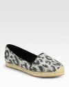 Leopard-print canvas with leather trim and a slight espadrille-inspired platform. Canvas upperLeather liningRubber solePadded insoleImportedOUR FIT MODEL RECOMMENDS ordering true size. 