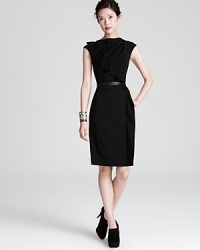 An artful ruffle adorns this sumptuous wool Escada dress with contrast leather belt. An artful ruffle adorns this sumptuous wool Escada dress with contrast leather belt.