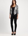 Embrace the wow factor in this cropped sequin blazer with dolman sleeves and a contour hem. Oversized shawl collarThree-quarter dolman sleevesContoured cropped back hemAbout 23 from shoulder to hemViscoseDry cleanImportedModel shown is 5'9 (176cm) wearing US size Small.