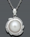 Prim and polished. This sophisticated pendant highlights a cultured freshwater pearl (9-10 mm) encircled by a pretty petal design accented with sparkling diamonds. Set in sterling silver. Approximate length: 18 inches. Approximate drop: 3/4 inch.