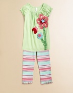 Adorned with ruffled flowers, a ladybug and stripes, this pretty, girly set will be her favorite and yours.ScoopneckShort puff sleevesPullover styleElastic waistbandPurl edge armbands and hemTunic: 95% cotton/5% spandexCapris: 97% cotton/3% spandexMachine washTunic: ImportedCapris: Imported of domestic fabric