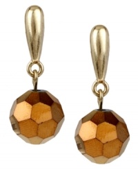 The bronze age is here. The metallic bronze tint on these Kenneth Cole New York cherry bead drop earrings lends a warm touch to your seasonal collection. Set in gold tone mixed metal. Approximate drop: 1 inch. The bronze age is here. The metallic bronze tint on these Kenneth Cole New York cherry bead drop earrings lends a warm touch to your seasonal collection. Set in gold tone mixed metal. Approximate drop: 1 inch.