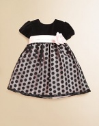 With a flower detail at the waist, gorgeous velvet and a polka-dot skirt, this pint-sized party dress is a must-have for the season.CrewneckBack button closureShort sleevesSash with flower detailTulle skirtPolyesterFully linedDry cleanMade in the USA of imported fabrics