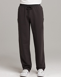 Sweat pants with two front pockets and one back pocket. Unfinished seam detail on sides. Elasticized waist with drawstring closure. Sweat pants with two front pockets and one back pocket. Unfinished seam detail on sides. Elasticized waist with drawstring closure.