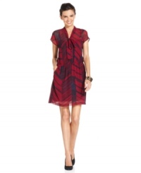 Inspired by ladylike tie-neck blouses, this floaty dress from DKNYC embraces modern edge with its crisp graphic print. Just add sophisticated pumps and glittering jewelry to complete the look. Inspired by ladylike tie-neck blouses, this floaty dress from DKNYC embraces modern edge with its crisp graphic print. Just add sophisticated pumps and glittering jewelry to complete the look.