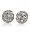 Sweet and sublime, earrings that offer a refreshing twist to your average stud. Created by Carolee, these intricate stud earrings feature a crafty pattern of white glass pearls and glass crystals. Set in silvertone mixed metal. Surgical steel posts. Approximate diameter: 1/2 inch.