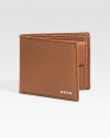 EXCLUSIVELY AT SAKS. A timeless leather classic, elegantly appointed in lightly textured leather with metal logo accents. One bill compartment Coin pocket Four card slots 4 X 3½ Made in Italy 