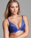 Natori's underwire bra features a plunging neckline that goes perfectly with all your low-cut tops and dresses. Sheer feather lace trim adds a sexy touch. Style #730023.