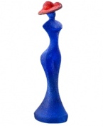 Ready for her closeup, the Madame Blue figurine from Kosta Boda is a vision of chic femininity. A textured surface is created with heated glass powder for added interest. Designed by Kjell Engman.