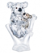 Give animal lovers and figurine collectors an irresistible bear hug. Mom and baby koala bears cuddle in radiant Swarovski crystal. Both have expressive jet crystal eyes and nose; cub features golden teak crystal fur.