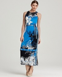 Go to great lengths in this Elie Tahari maxi dress showcasing graphic florals punctuated by statement stripes. Finish the look with sleek heels for modern appeal. Go to great lengths in this Elie Tahari maxi dress showcasing graphic florals punctuated by statement stripes. Finish the look with sleek heels for modern appeal.