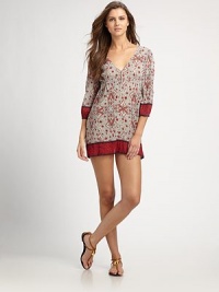 Chic crepe provides the luxe backdrop for this design featuring complementary paisley and floral prints.V-neckKeyhole necklineThree-quarter elasticized sleevesContrasting trimPull-on styleCottonMachine washImported