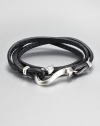 From the Dayak Collection. A strand of rich black leather wraps around the wrist, then closes with a bold sterling silver hook for a look of street-smart elegance.LeatherSterling silverStrap width, about .5Diameter, about 2.5Hook-and-loop closureMade in Bali