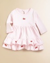 A sweet silhouette with embroidered cherries, picot trim, gathered waist and tiered ruffle hem. Crewneck Long sleeves Back keyhole with snap closure Hit just below knee Cotton Machine wash Imported