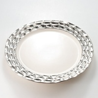Precious metals and porcelain capture the timeless shifting of ocean, wind and sand into lasting impressions inspired by the dunes of Truro, Cape Cod. Precious metals and porcelain capture the timeless shifting of ocean, wind and sand into lasting impressions inspired by the dunes of Truro, Cape Cod.