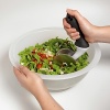 OXO salad chopper & bowl. This two-piece salad chopper set with durable bowl and rolling chopper hand tool has double stainless steel blades to efficiently slice greens, veggies and more. It has a generous angled, non-slip handle for comfortable chopping action. The bowl features a continuous curve for constant contact with blades.