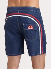 Solid, quick-drying swim trunks have a lace-up waist and signature rainbow detail across the back and down the leg.Drawstring waistRear flap pocketInseam, about 6NylonMachine washImported Solid, quick-drying swim trunks have a lace-up waist and signature rainbow detail across the back and down the leg.Drawstring waistRear flap pocketInseam, about 6NylonMachine washImported