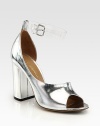 Mirrored metallic leather in a feminine d'Orsay silhouette, topped with an interchangeable, clear ankle strap and chunky block heel. Self-covered heel, 4 (100mm)Metallic leather upperLeather lining and solePadded insoleImportedPlease note: Silver and clear ankle straps are included. 