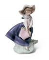 Enjoying the soft breeze and fresh flowers of spring, the little girl of Lladro's Pretty Pickings figurine exudes warmth and happiness. A classic for any collector, in glazed porcelain.