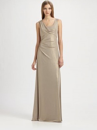 Fluid metallic jersey, in an artfully draped, floor-length style accented with a beaded shoulder detail.ScoopneckShoulder drape with beaded detailSleevelessEmpire seamSide gathers at waistBack cutout with gathered drapeAbout 42 from natural waist95% polyester/5% spandexDry cleanMade in USA of imported fabricModel shown is 5'10 (177cm) wearing US size 4. Fluid metallic jersey, in an artfully draped, floor-length style accented with a beaded shoulder detail.ScoopneckShoulder drape with beaded detailSleevelessEmpire seamSide gathers at waistBack cutout with gathered drapeAbout 42 from natural waist95% polyester/5% spandexDry cleanMade in USA of imported fabricModel shown is 5'10 (177cm) wearing US size 4.