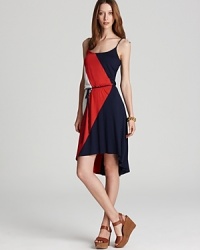 A classic Three Dots sundress takes flight with a color-blocked geometric print. Complement the on-trend high/low hem with lofty wedges and soar to new style heights. A classic Three Dots sundress takes flight with a color-blocked geometric print. Complement the on-trend high/low hem with lofty wedges and soar to new style heights.
