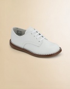 The timeless choice, expertly crafted in durable leather with excellent support and comfort.Leather upper Adjustable laces Padded insole Rubber traction sole Imported Please note: It is recommended that you order ½ size smaller than measured. If your child measures a size 7.0, you may want to order a 6½. 