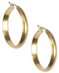 Amp up your jewelry box with these hoops from Jones New York. Finished with a wide design and a click top. Crafted from worn gold tone mixed metal. Approximate drop: 1-1/4 inches. Amp up your jewelry box with these hoops from Jones New York. Finished with a wide design and a click top. Crafted from worn gold tone mixed metal. Approximate drop: 1-1/4 inches.
