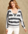 A deep V-neckline adds a sultry touch to Tommy Hilfiger's casual striped sweater. Layer it with a cami and jeans for essential everyday style.