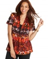 Enliven your neutral bottoms with Elementz' short sleeve plus size top, featuring a dramatic print!