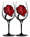 Inked with big red roses in eco-friendly paint, the handcrafted Tattoo wine glasses give your table a sense of rock n' roll cool. Designed by Ludvig Lofgren for Kosta Boda.