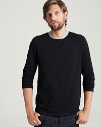 Long sleeve crewneck tee shirt in a comfortable, lightweight cotton. Contrasting, ringer collar. Long sleeve crewneck tee shirt in a comfortable, lightweight cotton. Contrasting, ringer collar.
