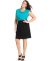 Wow them at work in Spense's sleeveless plus size dress, finished by a draped front and belted waist.