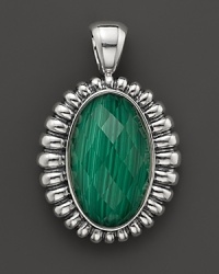 A faceted malachite doublet is trimmed in fluted sterling silver on this Lagos pendant. A faceted malachite doublet is trimmed in fluted sterling silver on this Lagos pendant.
