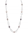Follow the must-have trend of the season by adding long, elegant layers. Majorica necklace features multicolored, organic, man-made pearls strung on a sterling silver link chain with toggle clasp. Approximate length: 36 inches.