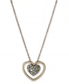 A romantic accent. This chic cut-out heart pendant is covered with round-cut diamonds (1/10 ct. t.w.) and crafted in 14k rose gold. Approximate length: 18 inches. Approximate drop: 1/3 inch.