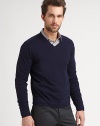 More than the ordinary pullover sweater, this v-neck knit is made from a stylish combination of cotton and cashmere.V-neckLong sleevesPullover70% cotton/30% cashmereDry cleanImported