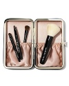For flawless makeup application wherever you go, Bobbi Brown kitted out her travel brush set with four tools of the trade (in tote-able sizes). Inspired by Bobbi's Caviar & Oyster Collection, this limited-edition set feels chic yet edgy in a sleek leather-like case lined with slipper-pink satin. No need to wrap-this set comes in a Bobbi Brown gift box covered in a pretty pearl print.Includes:• Mini Face Blender Brush • Mini Eye Shadow/ Ultra Fine Eyeliner Brush • New Mini Smokey Eye Liner Brush • Mini Lip Brush with cap