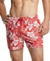 Paradise found.  These floral-patterned swim shorts from Hugo Boss are ready for sun-drenched days where the only umbrella you need is the one to stir your cocktail with.