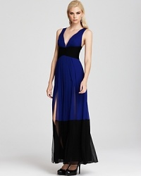 Opt for modern glamour in this floor-sweeping BCBGMAXAZRIA gown, boasting a striking two-tone color scheme. Opt for modern glamour in this floor-sweeping BCBGMAXAZRIA gown, boasting a striking two-tone color scheme.