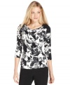 Calvin Klein's printed top features a fitted silhouette and flattering ruching.