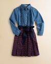 The timeless denim shirt with pintucking detail and a ruffled placket meets a colorful dot skirt for a fashion-forward ensemble.Shirt collarLong sleeves with button cuffsButton-frontBelted waistFull skirtCottonMachine washImported Please note: Number of buttons may vary depending on size ordered. 