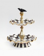 A beautifully handcrafted, tiered ceramic stand in a checkerboard juxtaposition of ivory and onyx with gold luster. The perfect addition to a buffet or party is fired three times for added strength to last a lifetime.Hand-painted and -glazed11.5 tallFluted plates, 9 diam.Hand washMade in the USA