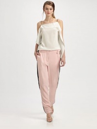 Tailored silk trousers have zippers at each side that adjust to reveal contrast inset panels.Bandless waistBelt loopsZip flySmooth frontWorking zippers at each side seam, from above the knee to the ankleBack besom pocketsRise, about 11Inseam, about 30½SilkDry cleanImported
