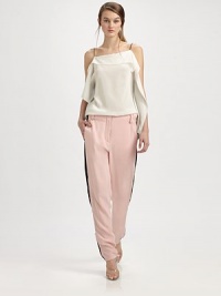Tailored silk trousers have zippers at each side that adjust to reveal contrast inset panels.Bandless waistBelt loopsZip flySmooth frontWorking zippers at each side seam, from above the knee to the ankleBack besom pocketsRise, about 11Inseam, about 30½SilkDry cleanImported Tailored silk trousers have zippers at each side that adjust to reveal contrast inset panels.Bandless waistBelt loopsZip flySmooth frontWorking zippers at each side seam, from above the knee to the ankleBack besom pocketsRise, about 11Inseam, about 30½SilkDry cleanImported