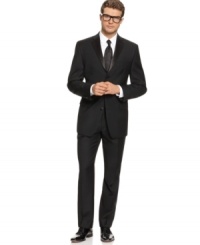 Exquisitely tailored in a fine serge wool, this elegantly modern tuxedo combines classic style with modern details for formal look that's not fussy. Sophisticated, fully lined three-button jacket features a notched satin lapel, chest welt pocket, front flap pockets with satin besom, three interior pockets and four-button detail at cuff. All buttons are satin covered for a subtle sheen. No back vent. Single-pleat pant features zip fly with extended tab closure, on-seam pockets, suspender buttons and an elegant satin side stripe. Unfinished hem. Jacket and pant sold together. Exquisitely tailored in a fine serge wool, this elegantly modern tuxedo combines classic style with modern details for formal look that's not fussy. Sophisticated, fully lined three-button jacket features a notched satin lapel, chest welt pocket, front flap pockets with satin besom, three interior pockets and four-button detail at cuff. All buttons are satin covered for a subtle sheen. No back vent. Single-pleat pant features zip fly with extended tab closure, on-seam pockets, suspender buttons and an elegant satin side stripe. Unfinished hem. Jacket and pant sold together.