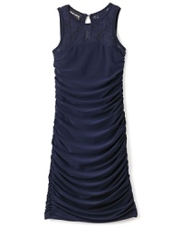 Cascading uching from the bust to hemline adds waves of texture to Un Deux Trois' lace dress. Cascading uching from the bust to hemline adds waves of texture to Un Deux Trois' lace dress.